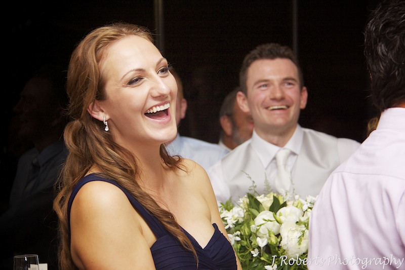 Bridesmaid laughing at wedding speeches - wedding photography sydney